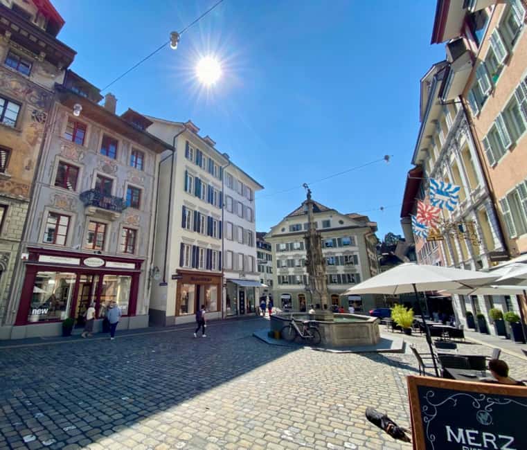 Basel: Swiss Alps Glacier Express Train Ride & Lucerne Tour - The private guide and the human side of the day