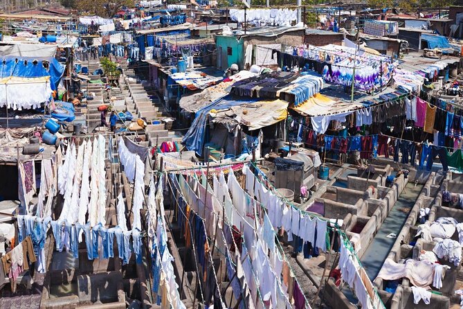 Dabbawala, Dhobi Ghat & Dharavi slum Tour with Local Train Ride - Mahalaxmi Dhobi Ghat and the open-air laundry