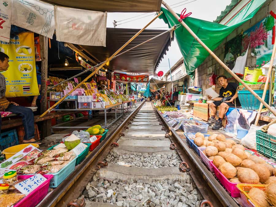 From Bangkok: Maeklong Railway and Floating Market Day Tour - A longtail boat ride into Damnoen Saduak