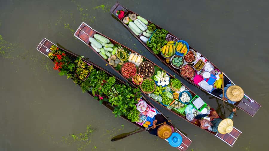 From Bangkok: Maeklong Railway and Floating Market Food Tour - Mae Klong Railway Market: the train comes through the stalls