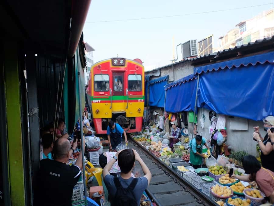 From Bangkok: Private Railway and Floating Market Tour - The railway market where the tracks are the aisle