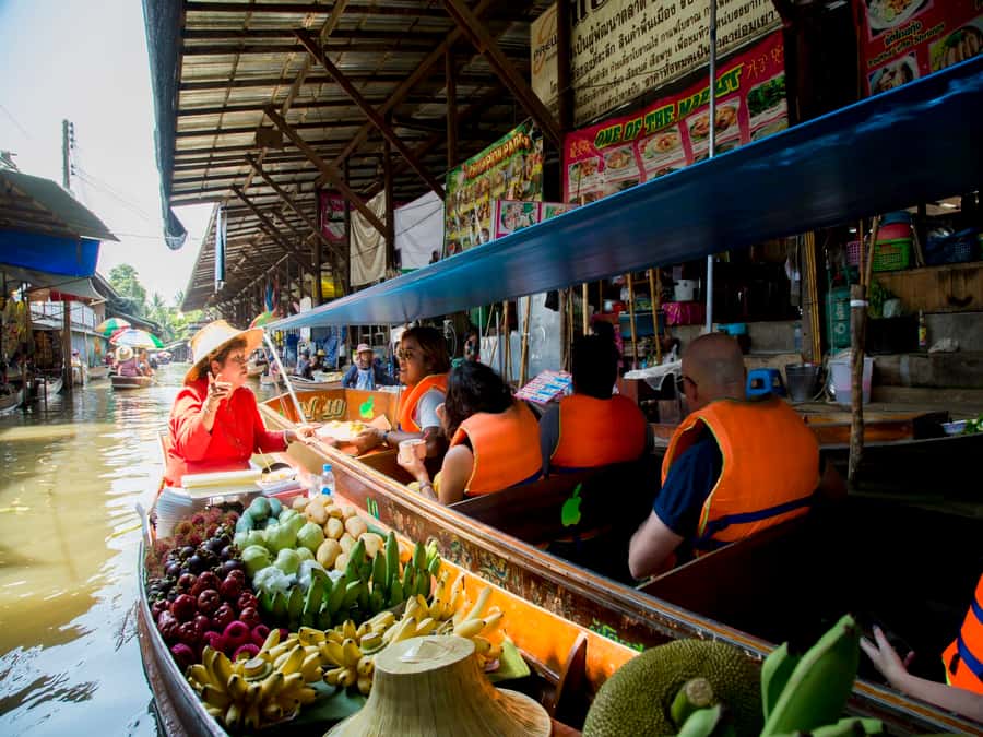 From Bangkok: Private Railway and Floating Market Tour - A small boat through narrow village canals