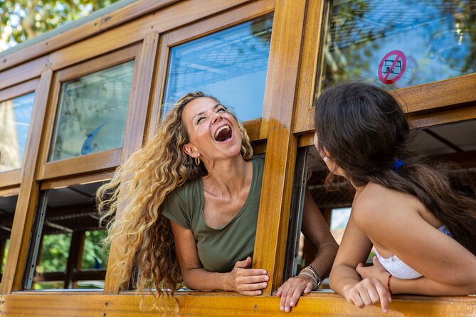 Mallorca in One Day Sightseeing Tour with Boat Ride and Vintage Train - Port de Sóller and the crowded orange tram