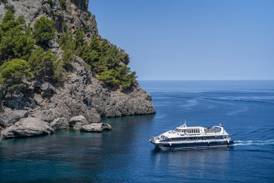 Mallorca: Island Tour with Boat, Tram & Train from the South - The coastal boat toward Sóller