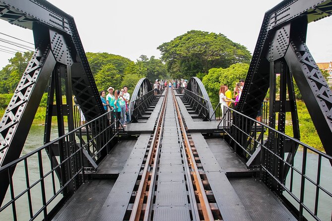 Private Kanchanaburi Ancient Death Railway Day Tour from Bangkok - Taking the long-tailed boat toward the bridge