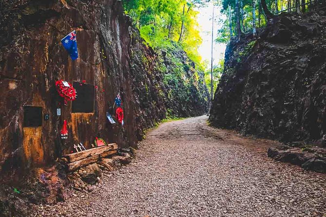 Private Tour: Death Railway, Hellfire Pass and Erawan Waterfall - Walking the Death Railway near the river