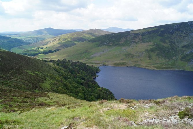 Wicklow Mountains, Avoca and Glendalough Rail Tour from Dublin - Glendalough’s lakes, ruins, and round tower